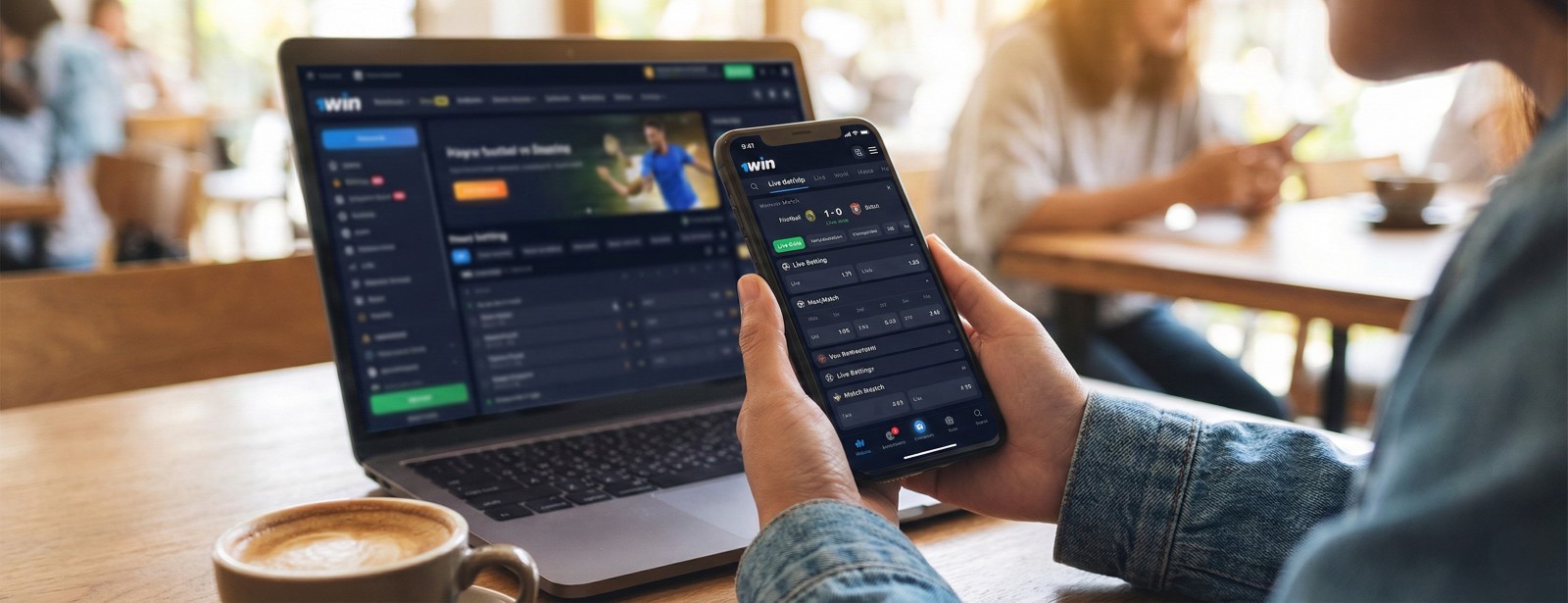 A user holding a smartphone with the 1win mobile app open next to a laptop displaying the sports betting website