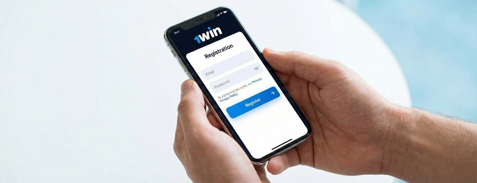 A person holding a smartphone displaying the 1win mobile registration form with email and password fields